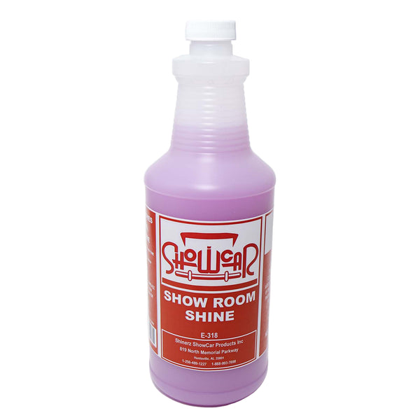 A quart bottle of a light pink liquid with a red ShowCar Show Room Shine label on a white background.