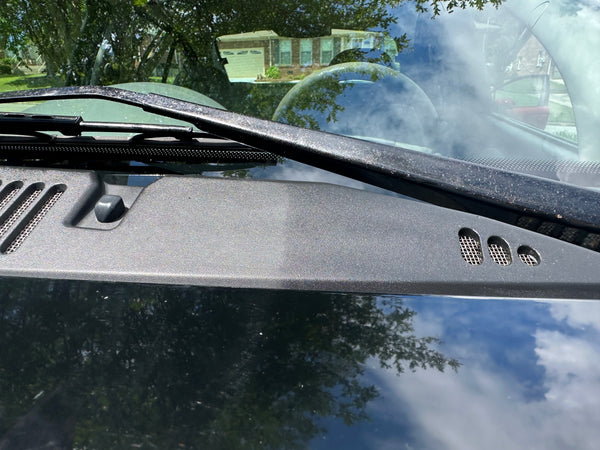 Close up photo of Ultra Shine applied to a vehicle windshield cowl