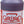 A quart bottle of purple liquid with a red ShowCar Purple Stuff label on a white background.