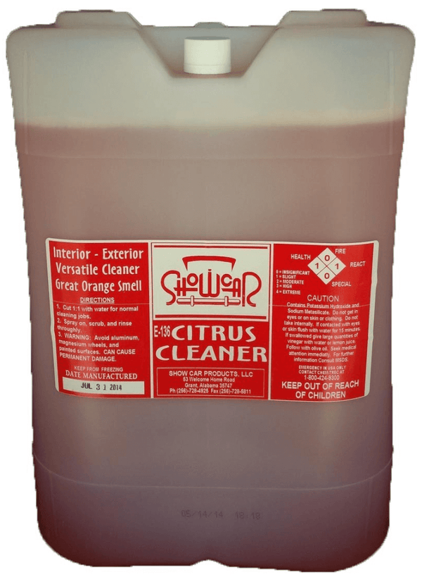 A 5 gallon bucket with orange liquid with a red ShowCar Citrus Cleaner label on a white background