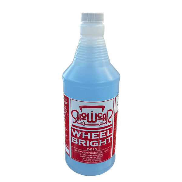 A quart bottle of light blue liquid with a red ShowCar Wheel Bright label on a white background.