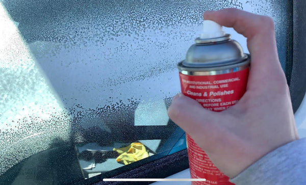 Showcar Glass Cleaner aerosol can being sprayed onto glass