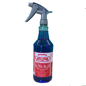 A blue bottle of Show Car Ultra Blue Tire Dressing with a white label and red lettering.